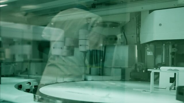 PCR robot in a medicine laboratory. Antibody test, PCR Test Covid 19. Modern biochemical analyzer filled with test tubes. spbd Genetics worker putting inserting test tubes bottles 