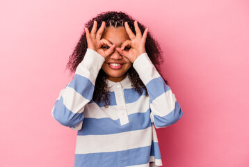 Young african american woman isolated on pink background excited keeping ok gesture on eye.