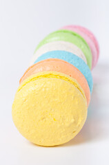 Colorful cake macaroons on a light background