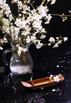 Still life with decorative wooden boat