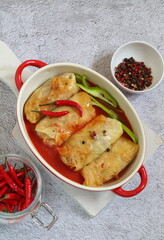 Cabbage rolls with minced meat on a gray background