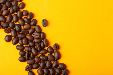 Roasted coffee beans on the color background for wallpaper or decor