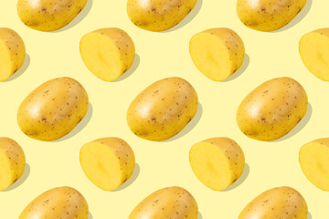 Seamless pattern of halved potatoes and whole tubers on a yellow background
