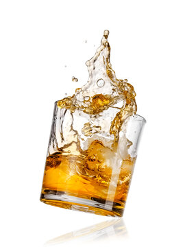 Glass of whiskey with ice up, close up