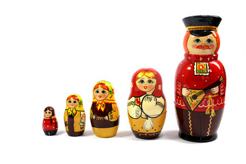 Collection of Wooden Nesting Stacking Dolls on White Background