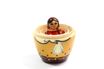 Collection of Wooden Nesting Stacking Dolls on White Background