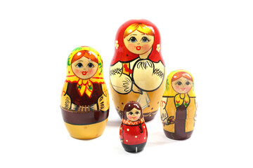 Collection of Wooden Nesting Stacking Dolls on White Background