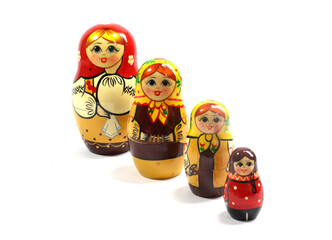 Collection of Wooden Nesting Stacking Dolls on White Background