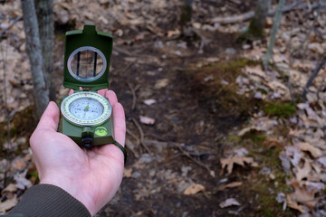 Point-of-view prismatic compass in the woods