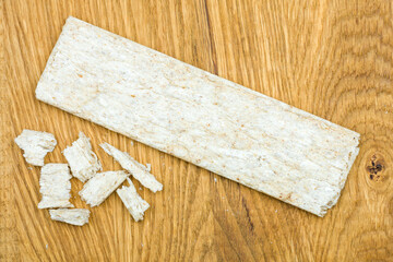 Crispbreads isolated on a wooden background, top view