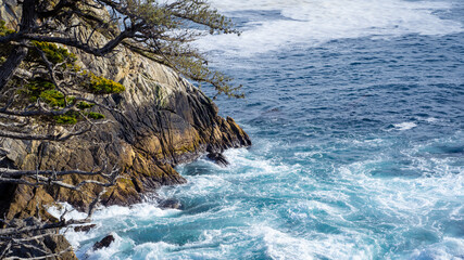 Waves crashing on rocks