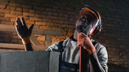 African American contractor singing during work