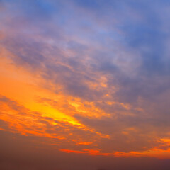 Naklejka na ściany i meble scenic of the strong sunrise and cloud on the orange sky.