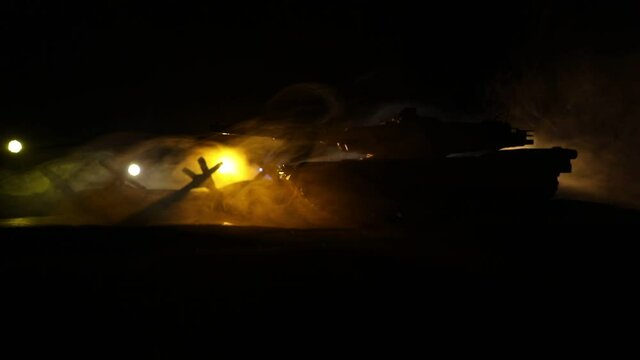 War Concept. Armored vehicle silhouette fighting scene on war foggy sky background at night. American tank moving in destroyed city. Slider shot