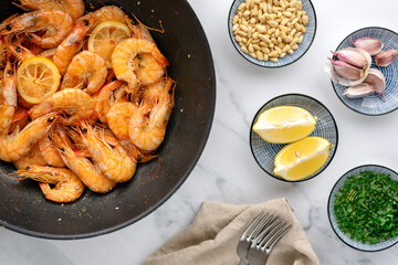 Roasted shrimps in a pan on the table.