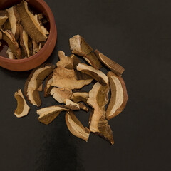 Dried Porcini Mushrooms. Toplay View. Boletus edulis mushrooms on a black background . Stock Image