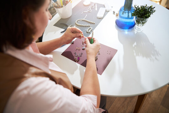 Jewelry Maker Working Alone In Her Studio