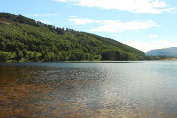 Fototapeta na wymiar Paddling in Loch Pityoulish in the summer