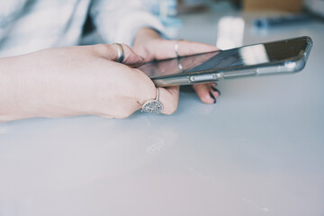 Obraz premium Teen hands holding a smart phone