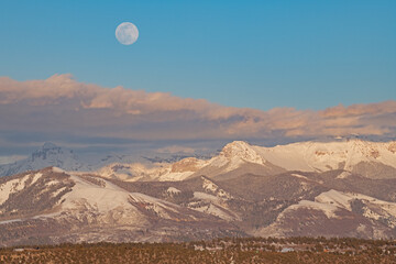 Winter landscape of the full moon rising over the San Juan Mountains, Colorado, USA