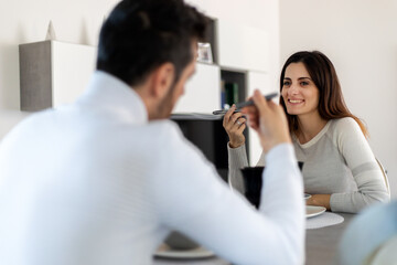 Fototapeta premium Attractive couplehaving a romantic dinner at home alone