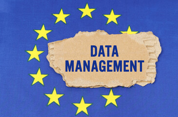 There is a cardboard box on the EU flag that says- DATA MANAGEMENT
