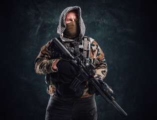 Fototapeta premium Special forces soldier dressed in military clothing and holding a rifle