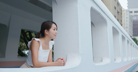 Woman look at the city view and sit at pedestrian tunnel