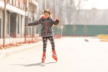 Young happy skater trying exciting outdoor activity