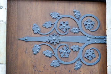 Door lock and door knocker on old doors photographed in daylight