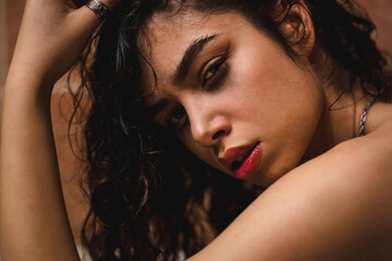 High fashion naked model with wet red lips and face woman under the studio lights