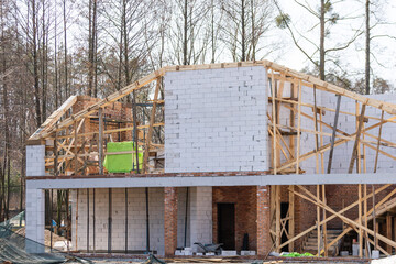 A new stick built home under construction. construction residential new house in progress at building site.The building structure are made from prefabrication system.