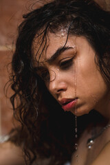 Beautiful model spa woman with splashes of water on her face