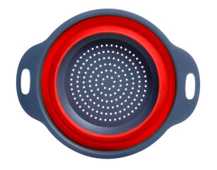 Collapsible silicone colander on white background isolation
