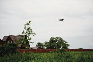 Fototapeta premium Private aircraft. Light aircraft flying over the field
