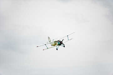Private aircraft. Light aircraft flying over the field