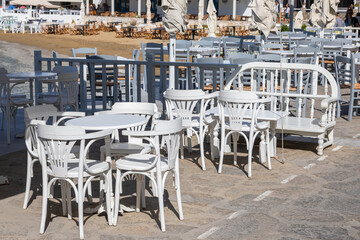 White tables at the local port restaurant. Piso Livadi, Paros Island, Greece.