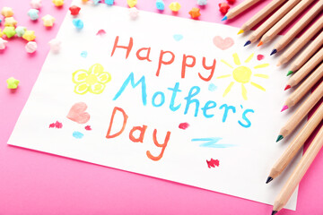 Text Happy Mother's Day with colorful pencils and paper stars on pink background