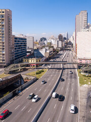 Fototapeta na wymiar Beautiful aerial view of Sao Paulo city skyline, buildings and cars in the street on sunny summer day. Brazil. Concept of urban, cityscape, metropolis, pollution, architecture.