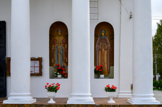 Icons of holy blessed prince Vladimir of Rzhev and holy righteous Pelageya of Rzhev on facade of cathedral of Okovetskaya Icon of God Mother, Rzhev, Tver region, Russia, September 20, 2020