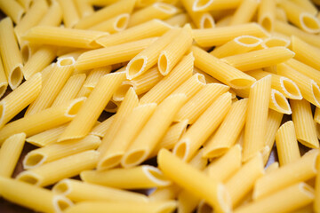 Healthy food on kitchen. Large yellow pasta