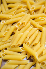 Healthy food on kitchen. Large yellow pasta