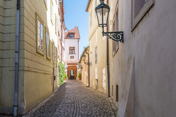 Fototapeta na wymiar View to the street in the old center of Prague - the capital and largest city of the Czech Republic - travel background