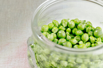 Fresh green peas in bowl