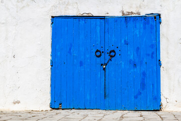 Decorative blue door. Typical blue studded wood or iron door in Sidi Bou Said, Tunisia, North Africa