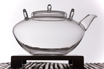 Silhouette of glass teapot on white background