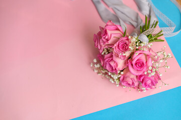 bouquet of roses on a pink background