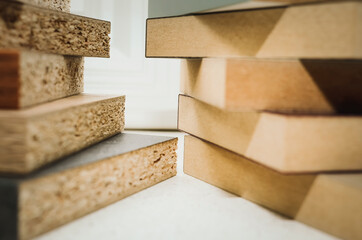Comparison of chipboard and mdf. Close-up, selective focus.