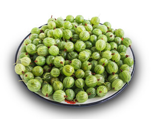 Fresh green gooseberries in a plate close-up, isolated. The view from top