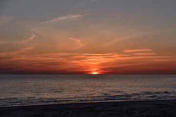 Fototapeta premium sunset at sea with a calm water surface
